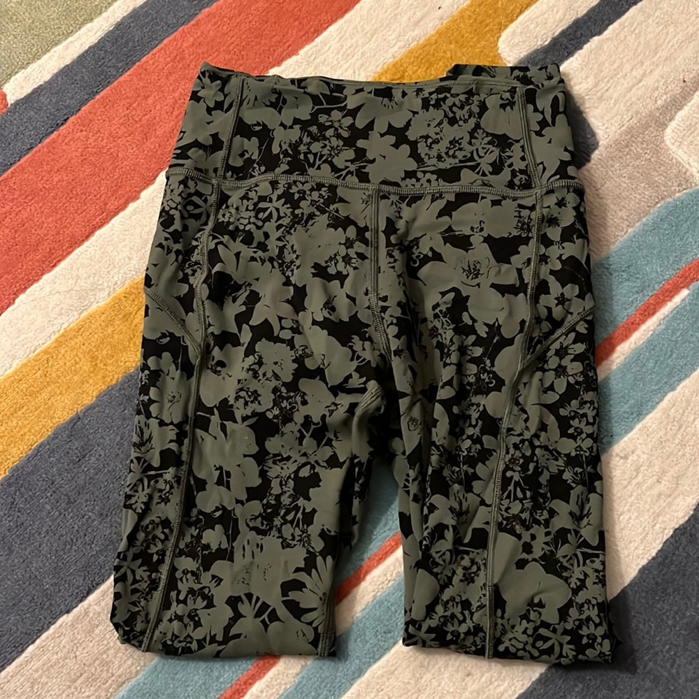 Lulu black and green flower patterned “pants” or leggings.